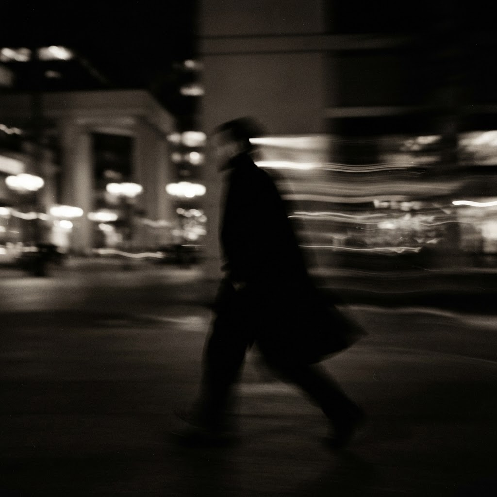 A blurred figure dissolving into light and movement